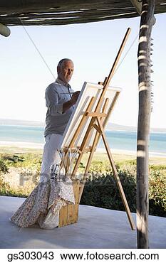 Stock Photo - painter outdoors 
with easel and 
supplies. fotosearch 
- search stock 
photos, pictures, 
images, and photo 
clipart