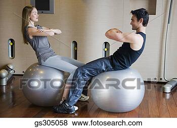 Stock Photo - couple exercising 
with fitness balls. 
fotosearch - search 
stock photos, 
pictures, images, 
and photo clipart