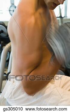 Stock Photography - man doing bicep 
curls. fotosearch 
- search stock 
photos, pictures, 
images, and photo 
clipart