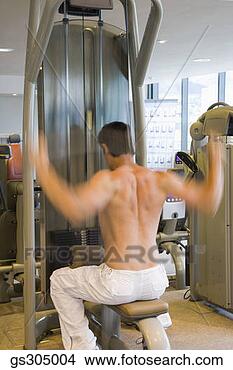 Stock Photo - man exercising 
in gym. fotosearch 
- search stock 
photos, pictures, 
images, and photo 
clipart