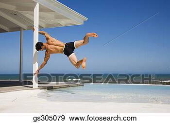 Stock Photograph - man swinging seaside 
porch. fotosearch 
- search stock 
photos, pictures, 
images, and photo 
clipart