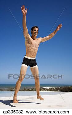 Stock Photo - shirtless man 
jumping on seashore. 
fotosearch - search 
stock photos, 
pictures, images, 
and photo clipart