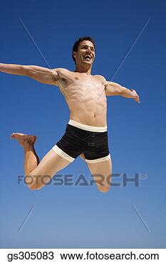 Stock Photo - shirtless man 
jumping in midair. 
fotosearch - search 
stock photos, 
pictures, images, 
and photo clipart