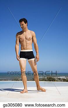 Stock Photography - shirtless man 
on seashore. fotosearch 
- search stock 
photos, pictures, 
images, and photo 
clipart
