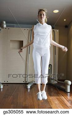 Stock Image - woman jumping 
rope. fotosearch 
- search stock 
photos, pictures, 
images, and photo 
clipart