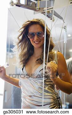 Stock Photography - woman resistance 
training in sunglasses. 
fotosearch - search 
stock photos, 
pictures, images, 
and photo clipart