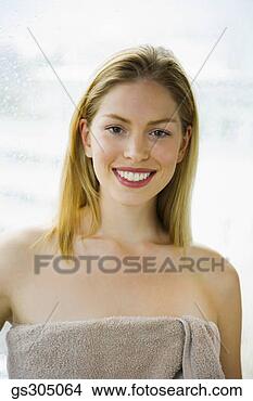 Stock Photo - woman smiling 
in towel. fotosearch 
- search stock 
photos, pictures, 
images, and photo 
clipart