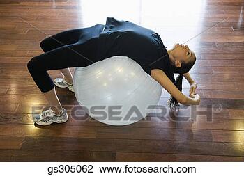 Stock Photo - woman stretching 
over fitness ball. 
fotosearch - search 
stock photos, 
pictures, images, 
and photo clipart