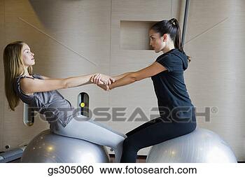 Stock Photography - women exercising 
with fitness balls. 
fotosearch - search 
stock photos, 
pictures, images, 
and photo clipart