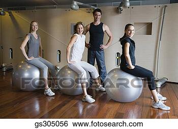 Stock Photo - women in gym class 
with fitness balls. 
fotosearch - search 
stock photos, 
pictures, images, 
and photo clipart