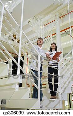 Stock Photograph - serious businesspeople 
on stairway. fotosearch 
- search stock 
photos, pictures, 
images, and photo 
clipart
