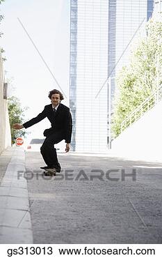 Stock Photo - businessman riding 
skateboard. fotosearch 
- search stock 
photos, pictures, 
images, and photo 
clipart