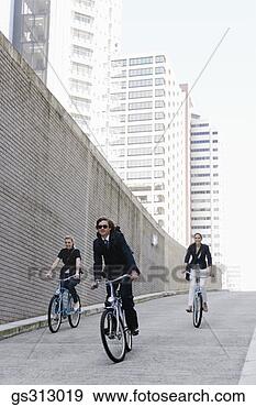 Stock Photograph - businesspeople 
riding bicycles. 
fotosearch - search 
stock photos, 
pictures, images, 
and photo clipart