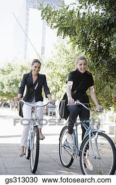 Stock Photography - businesswomen 
riding bicycles. 
fotosearch - search 
stock photos, 
pictures, images, 
and photo clipart