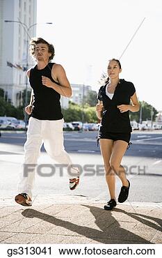 Stock Photography - couple jogging 
in city. fotosearch 
- search stock 
photos, pictures, 
images, and photo 
clipart