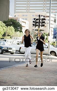 Picture - couple jogging 
near city street. 
fotosearch - search 
stock photos, 
pictures, images, 
and photo clipart