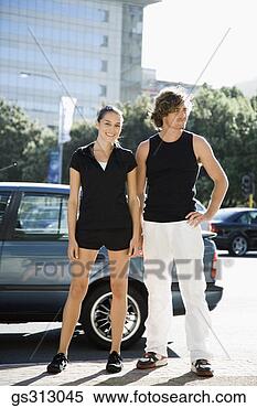 Stock Image - couple standing 
next to city street. 
fotosearch - search 
stock photos, 
pictures, images, 
and photo clipart