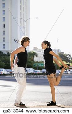 Stock Photo - couple stretching 
in city. fotosearch 
- search stock 
photos, pictures, 
images, and photo 
clipart
