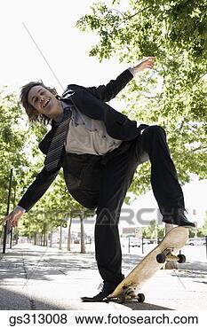 Stock Photo - smiling businessman 
riding skateboard. 
fotosearch - search 
stock photos, 
pictures, images, 
and photo clipart