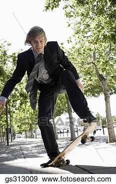 Stock Photograph - smiling businessman 
riding skateboard. 
fotosearch - search 
stock photos, 
pictures, images, 
and photo clipart