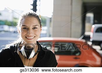 Stock Photo - smiling woman 
with headphones. 
fotosearch - search 
stock photos, 
pictures, images, 
and photo clipart