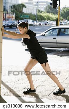 Stock Photo - woman stretching 
near city street. 
fotosearch - search 
stock photos, 
pictures, images, 
and photo clipart