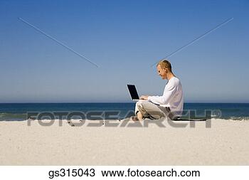Stock Photo - man on beach with 
laptop. fotosearch 
- search stock 
photos, pictures, 
images, and photo 
clipart
