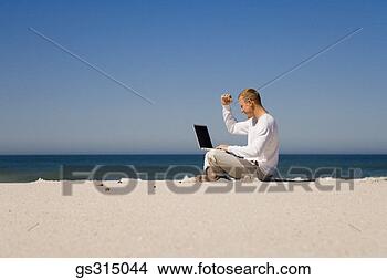 Stock Photo - man on beach with 
laptop. fotosearch 
- search stock 
photos, pictures, 
images, and photo 
clipart