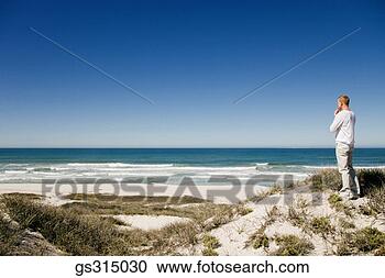 Stock Photography - man at beach. 
fotosearch - search 
stock photos, 
pictures, images, 
and photo clipart