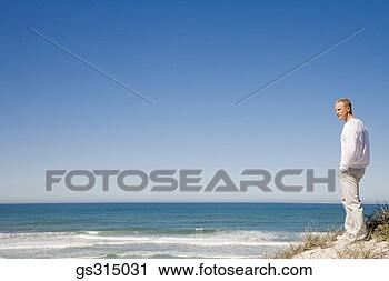 Stock Photography - man at beach. 
fotosearch - search 
stock photos, 
pictures, images, 
and photo clipart