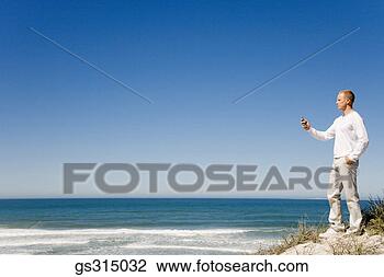 Stock Photo - man at beach. 
fotosearch - search 
stock photos, 
pictures, images, 
and photo clipart