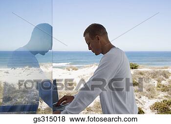 Stock Photo - man with laptop. 
fotosearch - search 
stock photos, 
pictures, images, 
and photo clipart