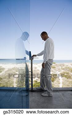 Stock Photography - man with laptop. 
fotosearch - search 
stock photos, 
pictures, images, 
and photo clipart