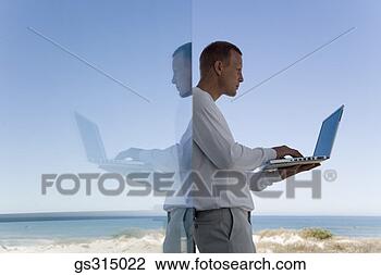 Stock Photo - man with laptop. 
fotosearch - search 
stock photos, 
pictures, images, 
and photo clipart