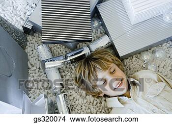 Stock Photo - boy lying on floor 
by gifts. fotosearch 
- search stock 
photos, pictures, 
images, and photo 
clipart