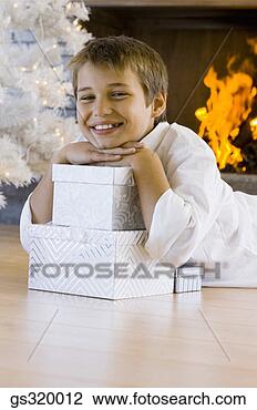 Stock Photo - boy smiling with 
christmas gifts. 
fotosearch - search 
stock photos, 
pictures, images, 
and photo clipart