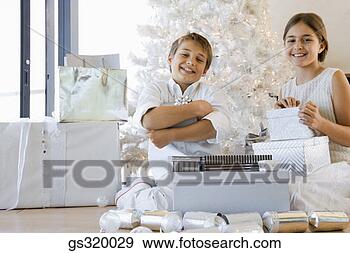 Stock Photograph - children with 
christmas gifts. 
fotosearch - search 
stock photos, 
pictures, images, 
and photo clipart