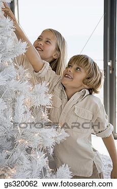 Stock Photo - children decorating 
christmas tree. 
fotosearch - search 
stock photos, 
pictures, images, 
and photo clipart