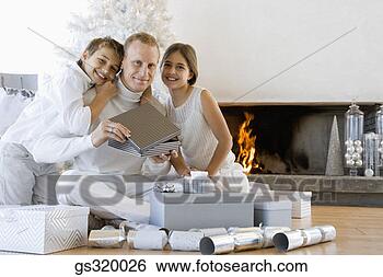 Stock Photo - children with 
father opening 
christmas gift. 
fotosearch - search 
stock photos, 
pictures, images, 
and photo clipart