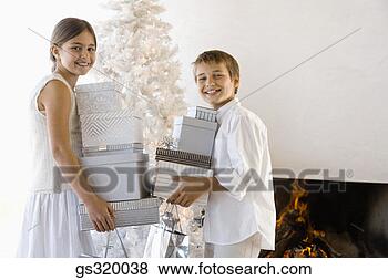 Stock Photo - children holding 
christmas gifts. 
fotosearch - search 
stock photos, 
pictures, images, 
and photo clipart