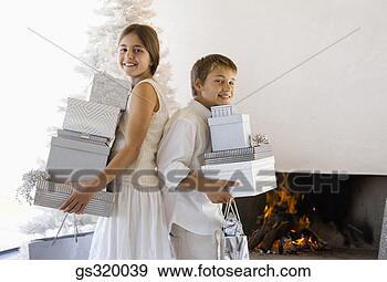 Stock Photograph - children holding 
christmas gifts. 
fotosearch - search 
stock photos, 
pictures, images, 
and photo clipart