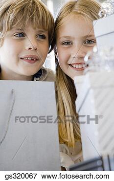 Picture - children smiling 
by gifts. fotosearch 
- search stock 
photos, pictures, 
images, and photo 
clipart