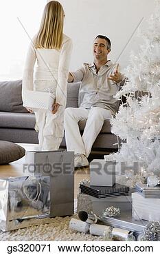 Stock Photography - daughter holding 
christmas gift 
for father. fotosearch 
- search stock 
photos, pictures, 
images, and photo 
clipart
