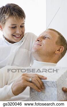 Stock Photo - father and son 
with gift. fotosearch 
- search stock 
photos, pictures, 
images, and photo 
clipart