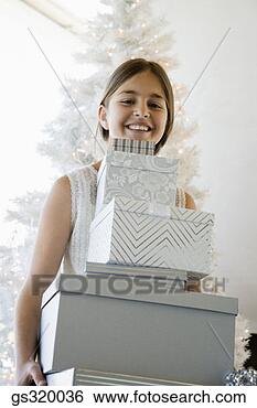 Stock Photo - girl smiling with 
christmas gifts. 
fotosearch - search 
stock photos, 
pictures, images, 
and photo clipart