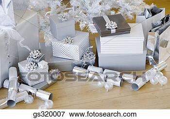 Picture - piled christmas 
gifts. fotosearch 
- search stock 
photos, pictures, 
images, and photo 
clipart