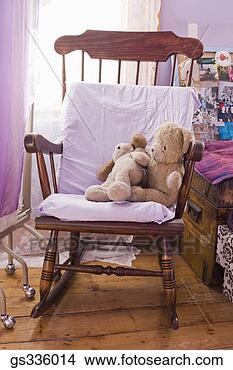 Stock Photo - rocking chair 
and stuffed animals. 
fotosearch - search 
stock photos, 
pictures, images, 
and photo clipart