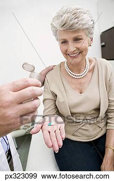 Stock Photograph - doctor giving 
medicine to patient. 
fotosearch - search 
stock photos, 
pictures, images, 
and photo clipart