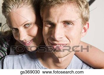 Stock Photography - head shot portrait 
of a young couple. 
fotosearch - search 
stock photos, 
pictures, images, 
and photo clipart