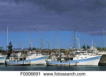 Stock Photography - reunion, storm 
over the harbour. 
fotosearch - search 
stock photos, 
pictures, images, 
and photo clipart